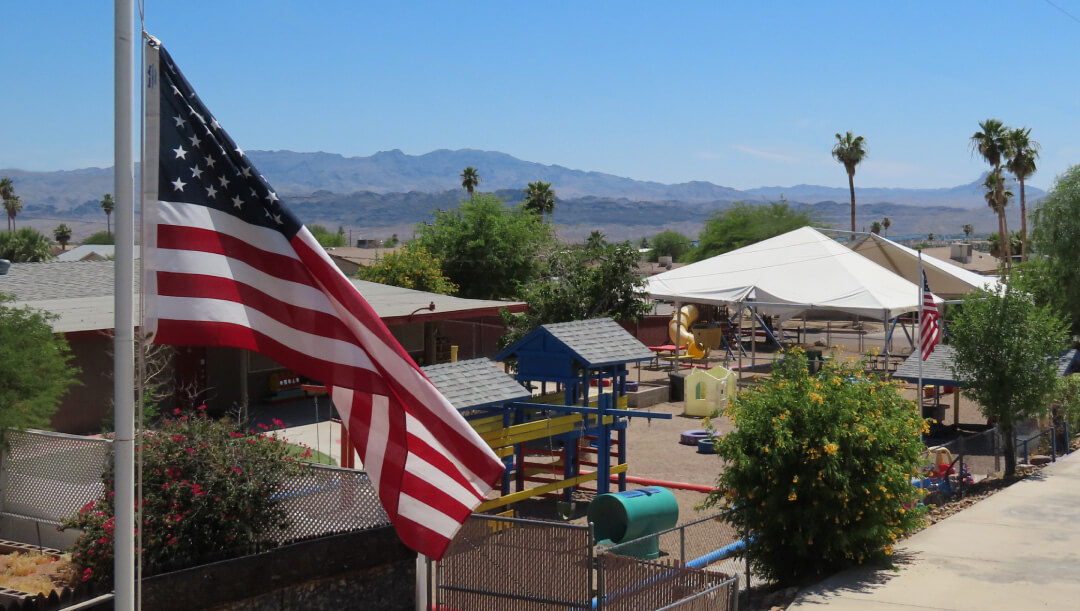 A shot of the preschool with the American Flag.